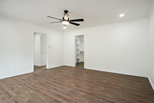 unfurnished room with ceiling fan, dark hardwood / wood-style floors, and crown molding