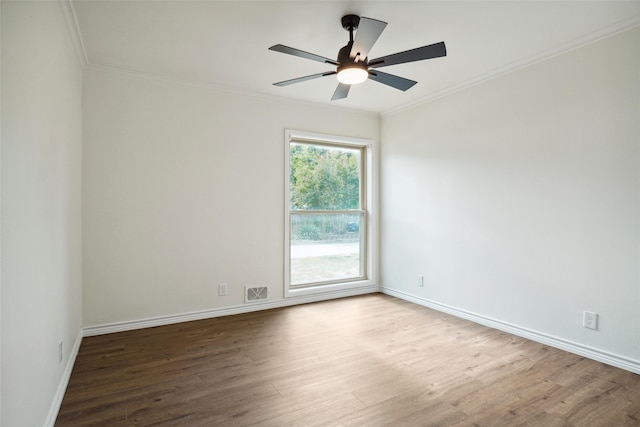 spare room featuring hardwood / wood-style flooring, crown molding, and ceiling fan