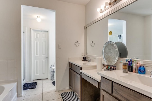 bathroom with vanity, tile patterned floors, and separate shower and tub