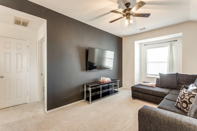 carpeted living room with vaulted ceiling and ceiling fan