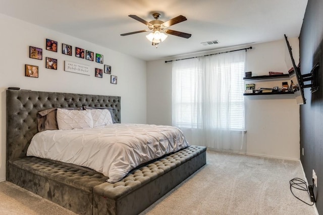 bedroom with light colored carpet and ceiling fan