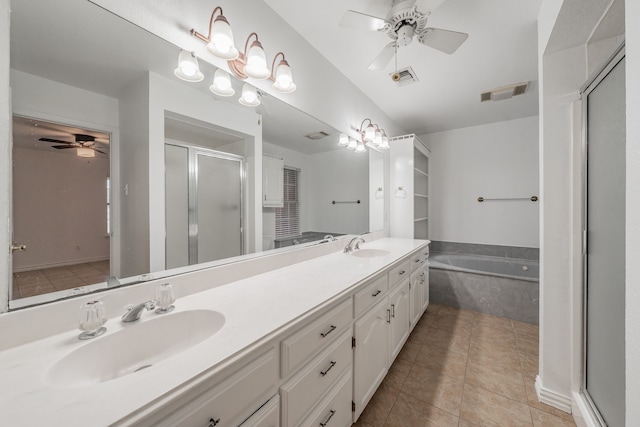 bathroom with vanity, ceiling fan, tile patterned flooring, and plus walk in shower