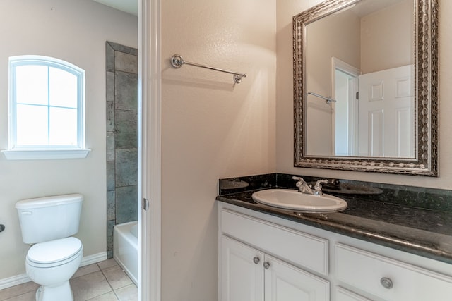 full bathroom featuring vanity, tile patterned floors, toilet, and tiled shower / bath