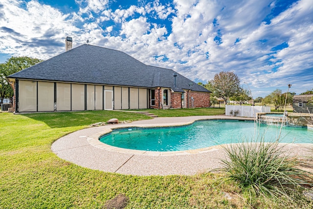 view of pool featuring central AC unit and a lawn