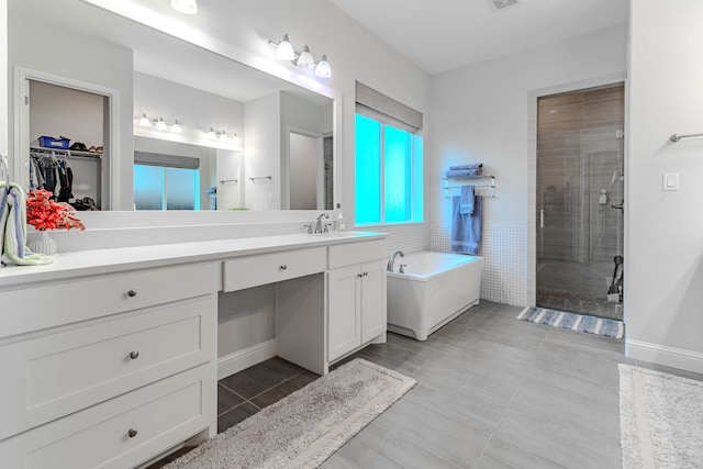 bathroom with vanity, tile patterned floors, and independent shower and bath