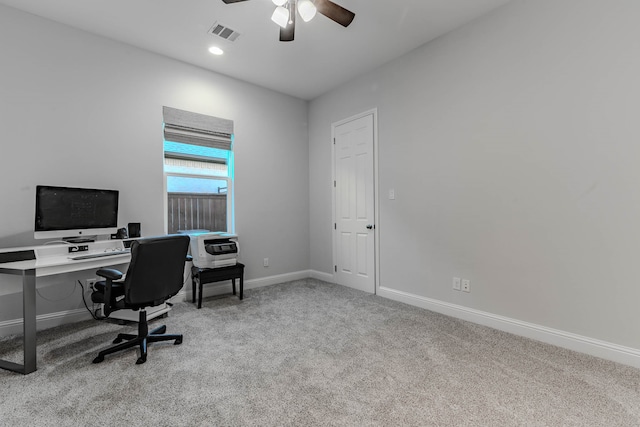 home office featuring light colored carpet and ceiling fan