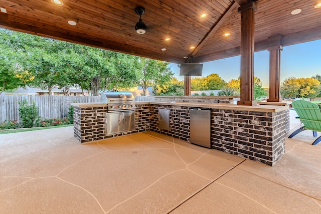 view of patio / terrace featuring a grill, area for grilling, and sink