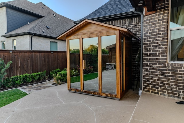 exterior space with wooden walls and brick wall