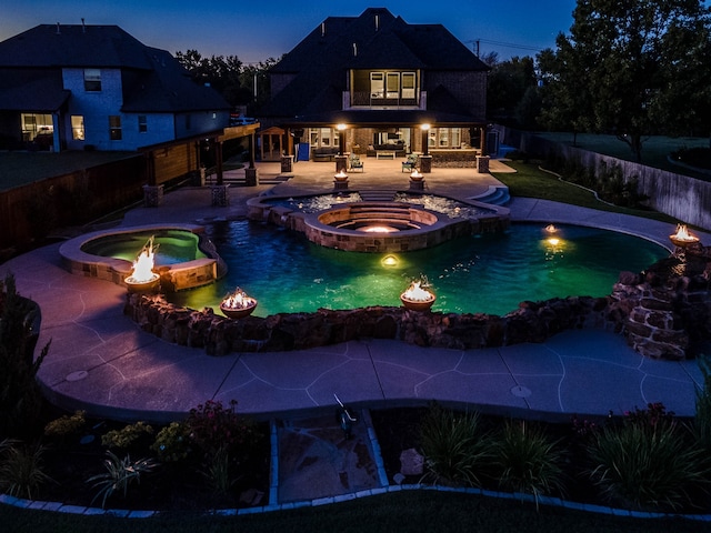 view of swimming pool with a patio and an in ground hot tub