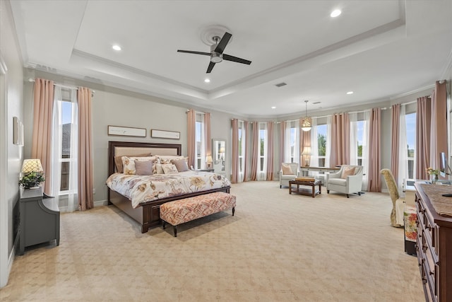 bedroom featuring crown molding, light carpet, ceiling fan, and a raised ceiling