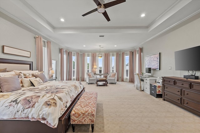 bedroom with light colored carpet, a raised ceiling, ceiling fan, and crown molding