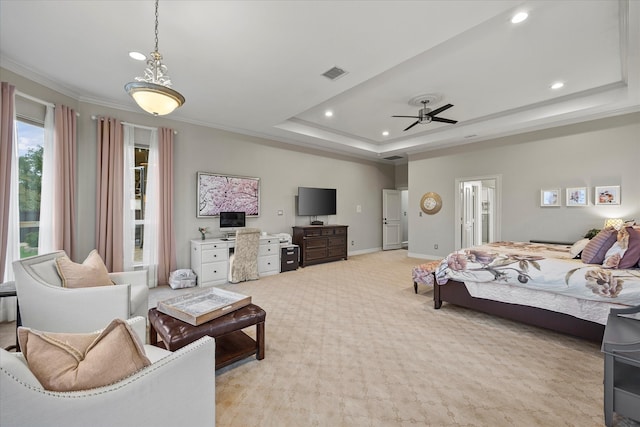 carpeted bedroom featuring crown molding, ceiling fan, and a raised ceiling