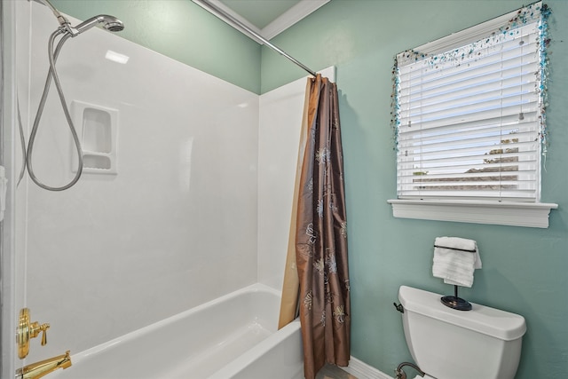 bathroom featuring toilet and shower / tub combo