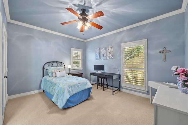 carpeted bedroom featuring ceiling fan and crown molding