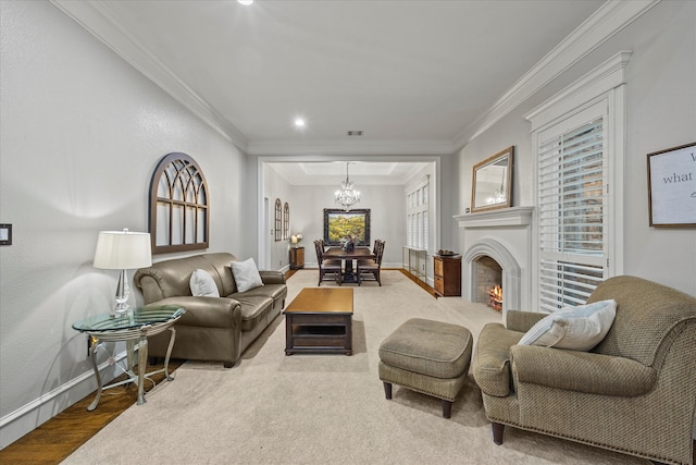 living room with a notable chandelier, hardwood / wood-style flooring, and crown molding