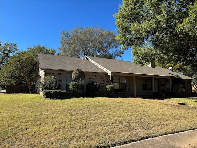 single story home with a front yard