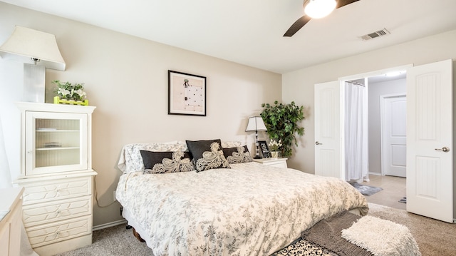 bedroom with ceiling fan and light colored carpet