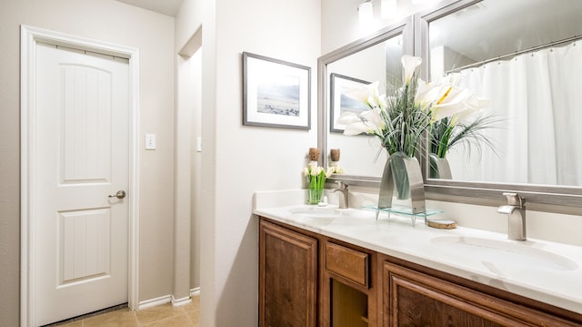 bathroom with vanity and tile patterned flooring