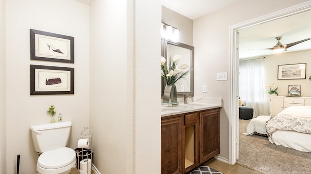 bathroom with vanity, tile patterned floors, toilet, and ceiling fan