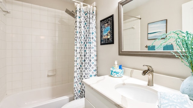 full bathroom with vanity, shower / bath combo with shower curtain, and toilet