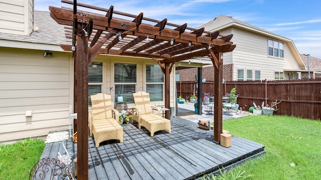 wooden terrace with a patio, a yard, and a pergola