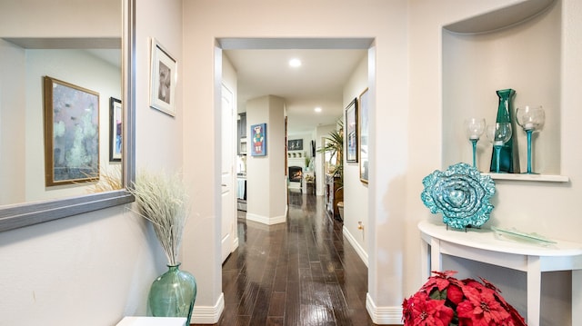 corridor featuring dark hardwood / wood-style flooring