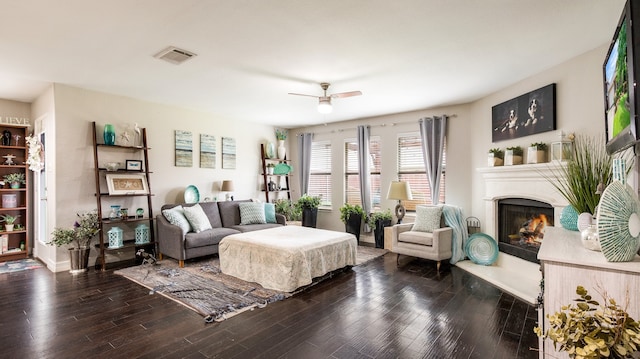 living room featuring dark hardwood / wood-style floors and ceiling fan