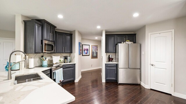 2006 Samantha Ln, Heartland, TX 75126 - kitchen featuring stainless steel appliances, a sink, baseboards, light stone countertops, and recessed lighting