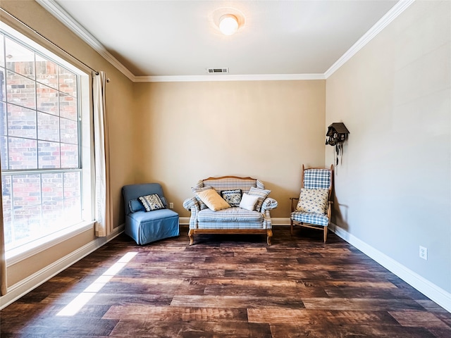 living area featuring ornamental molding and dark hardwood / wood-style floors