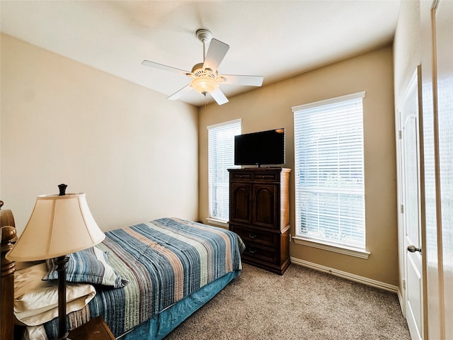 carpeted bedroom with ceiling fan