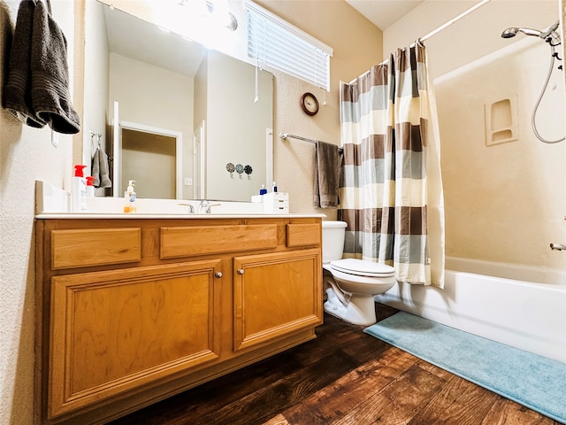 full bathroom featuring toilet, vanity, shower / bath combo with shower curtain, and hardwood / wood-style flooring