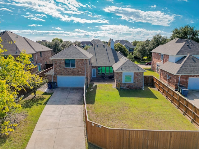 view of front facade featuring a front lawn and a garage