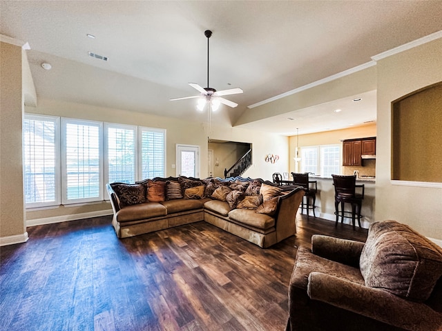 living room with ceiling fan, lofted ceiling, dark hardwood / wood-style floors, and crown molding