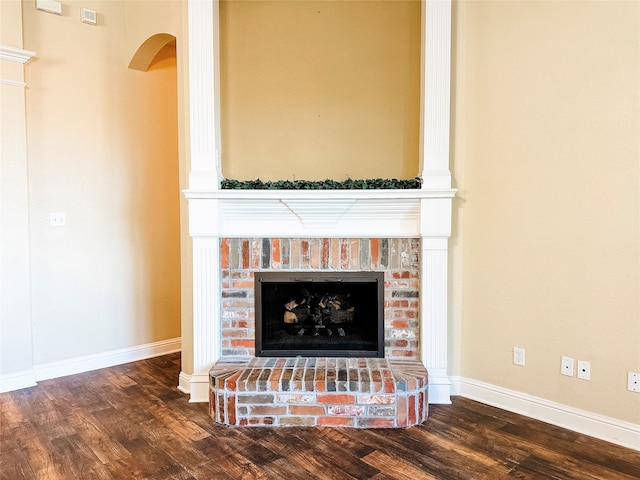 room details featuring wood-type flooring and a fireplace