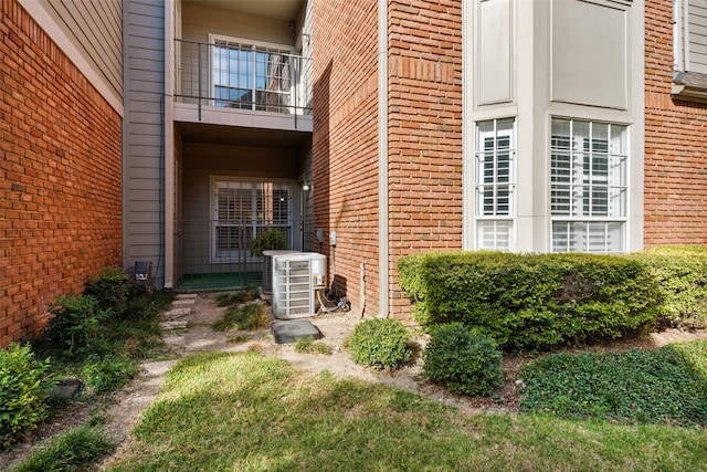 entrance to property featuring central AC and a balcony