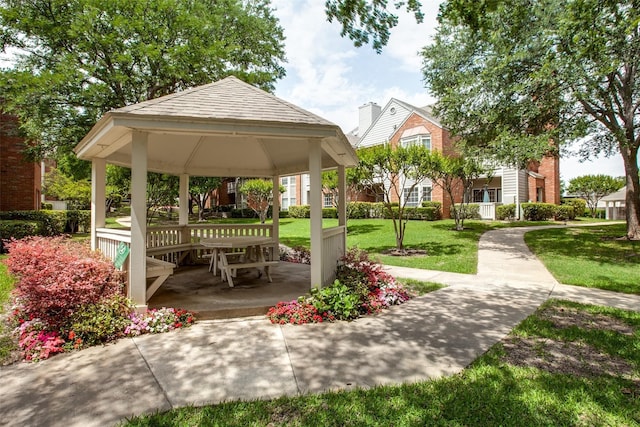 view of community featuring a yard and a gazebo