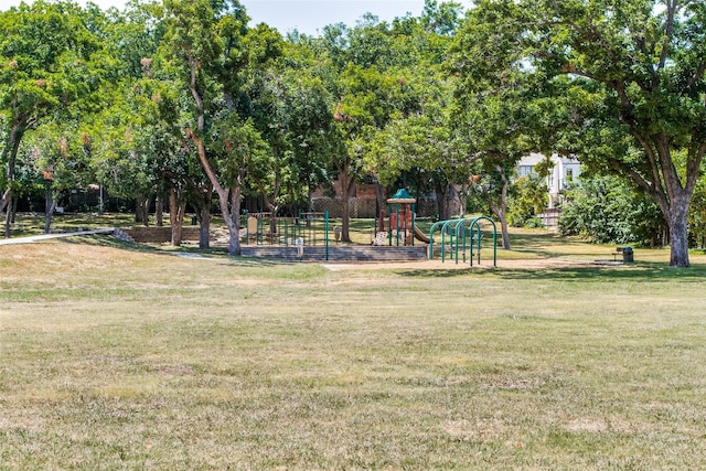 view of jungle gym with a lawn