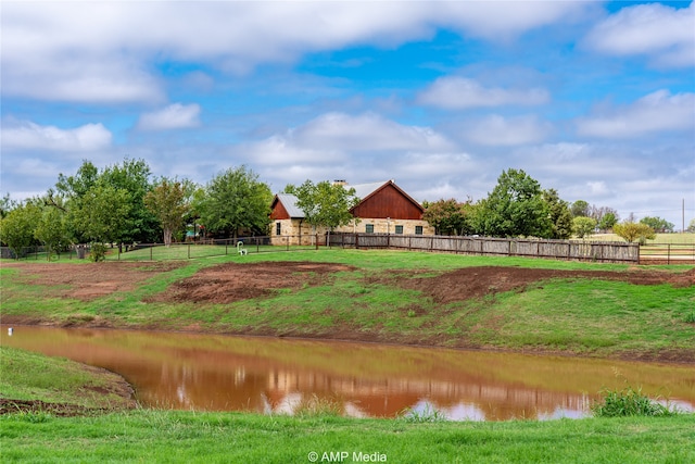 surrounding community featuring a water view