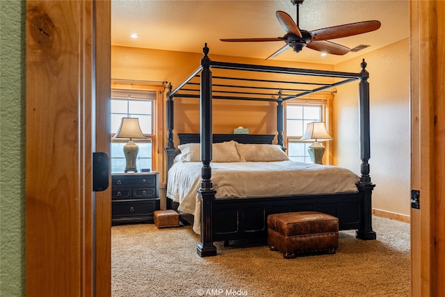 carpeted bedroom featuring ceiling fan