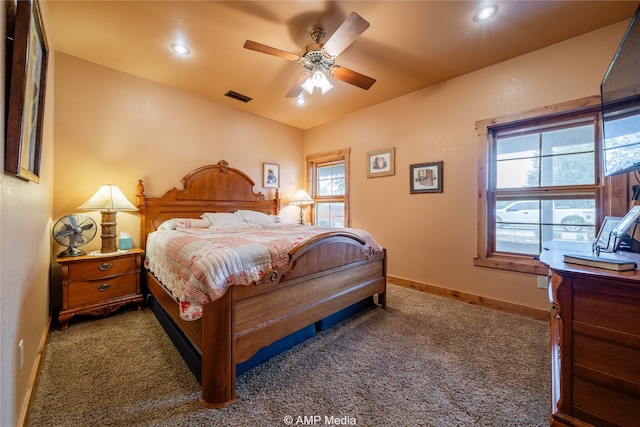 bedroom featuring dark carpet and ceiling fan