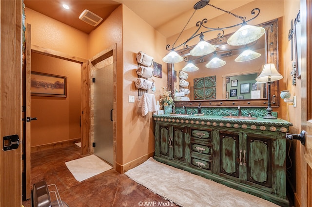 bathroom featuring walk in shower and vanity