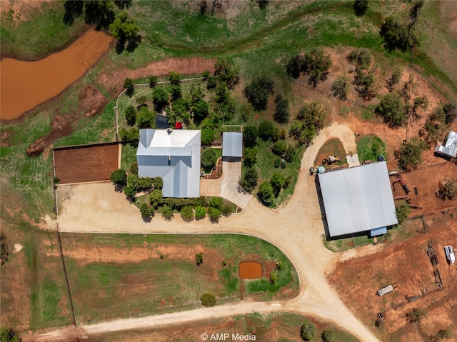 birds eye view of property featuring a rural view