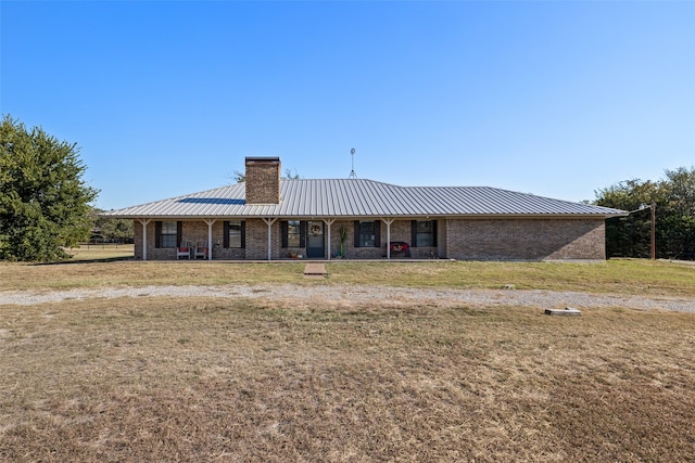 ranch-style house with a front yard