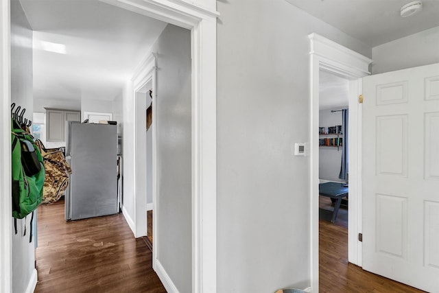 hall with dark hardwood / wood-style flooring