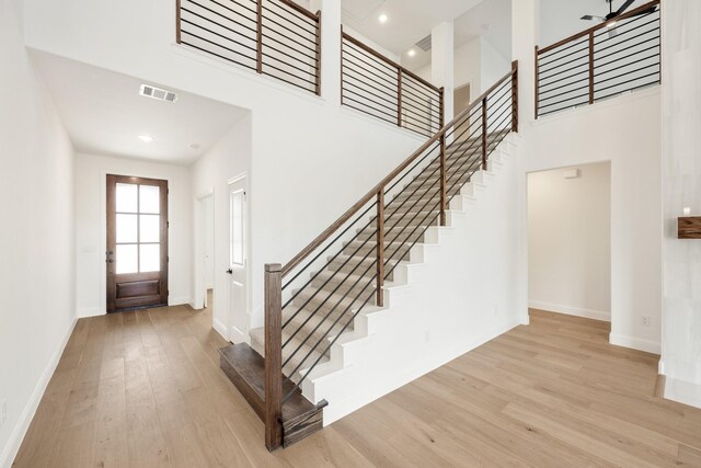 unfurnished room featuring visible vents, baseboards, lofted ceiling, carpet, and recessed lighting