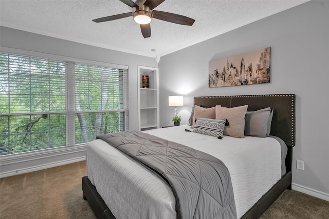 bedroom featuring multiple windows, ceiling fan, dark carpet, and a textured ceiling