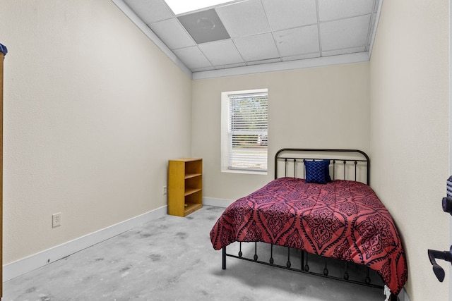 bedroom with a paneled ceiling