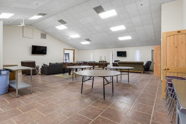 playroom with high vaulted ceiling and a paneled ceiling