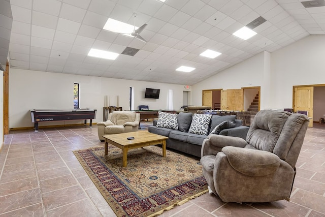 living room with pool table, vaulted ceiling, and a drop ceiling