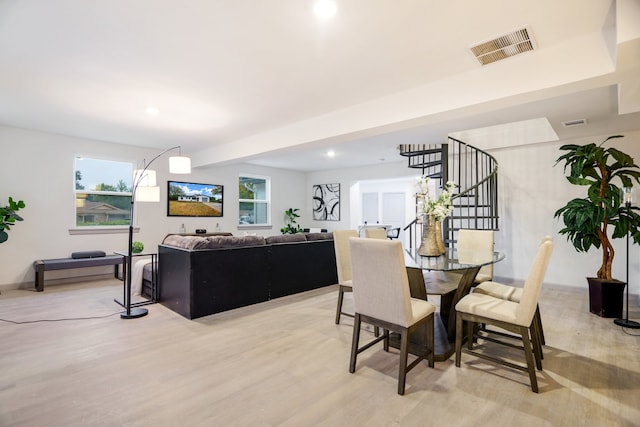 dining area with light hardwood / wood-style flooring